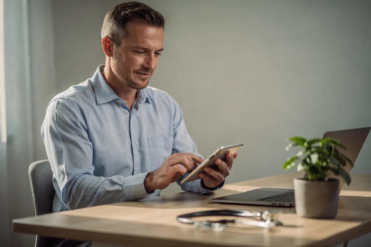 A clinician reviewing a refill request on a tablet